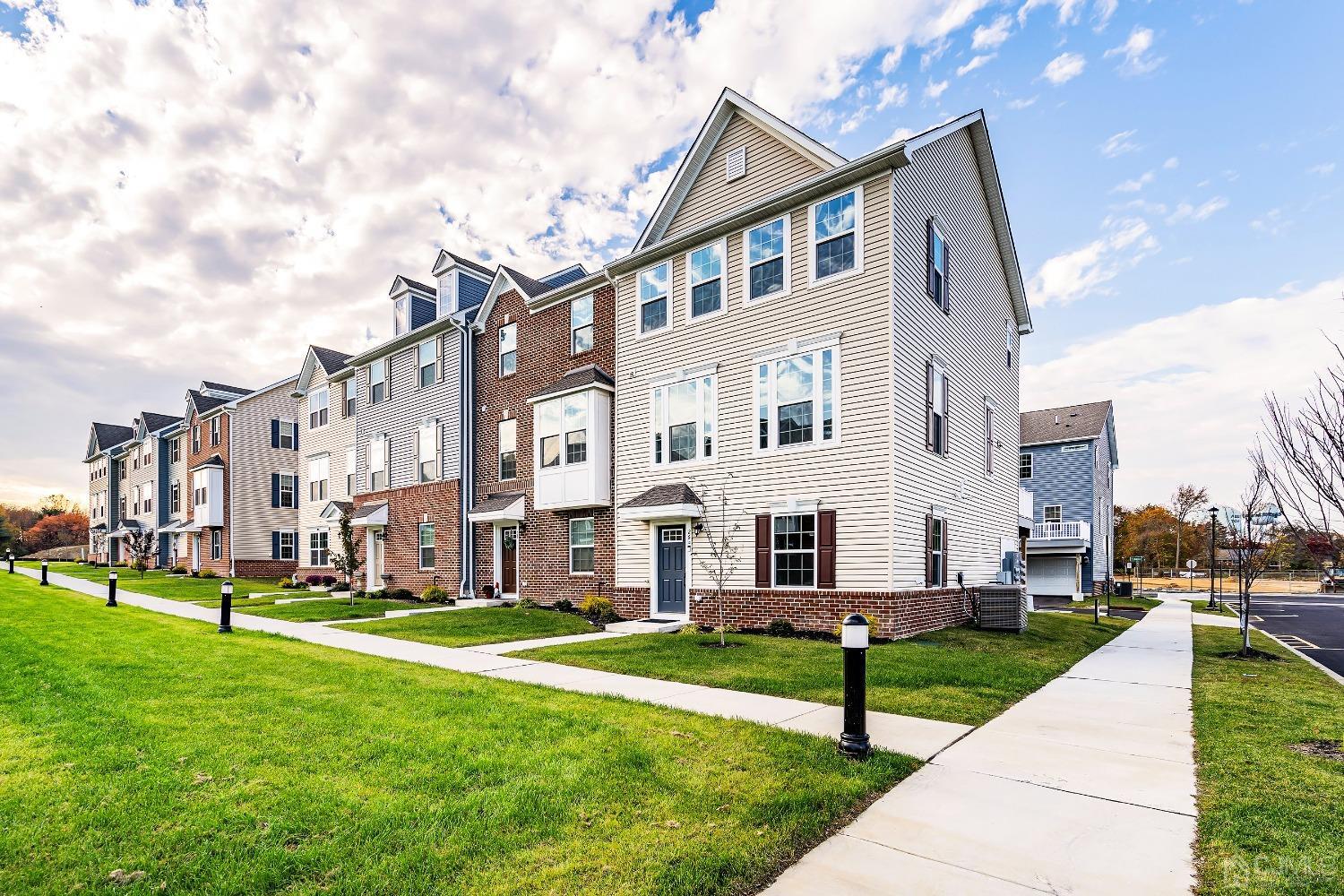 26 American Way Cliffwood, NJ 07721 - Photo 2 of 32 a front view of a building with a yard