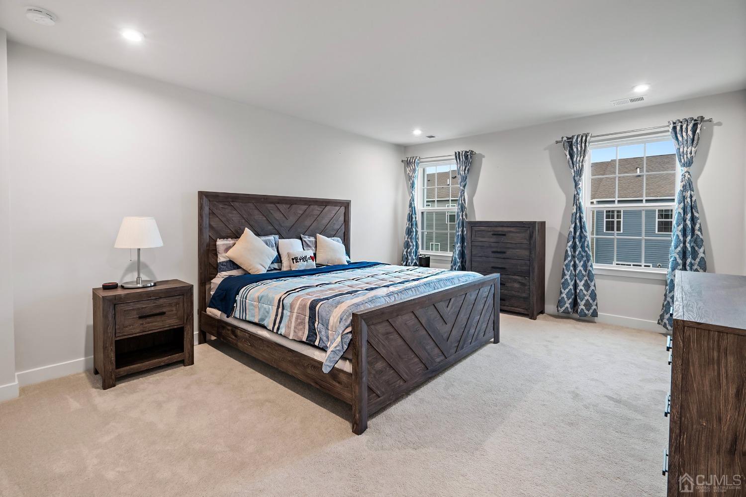 26 American Way Cliffwood, NJ 07721 - Photo 22 of 32 a spacious bedroom with a bed and wooden floor