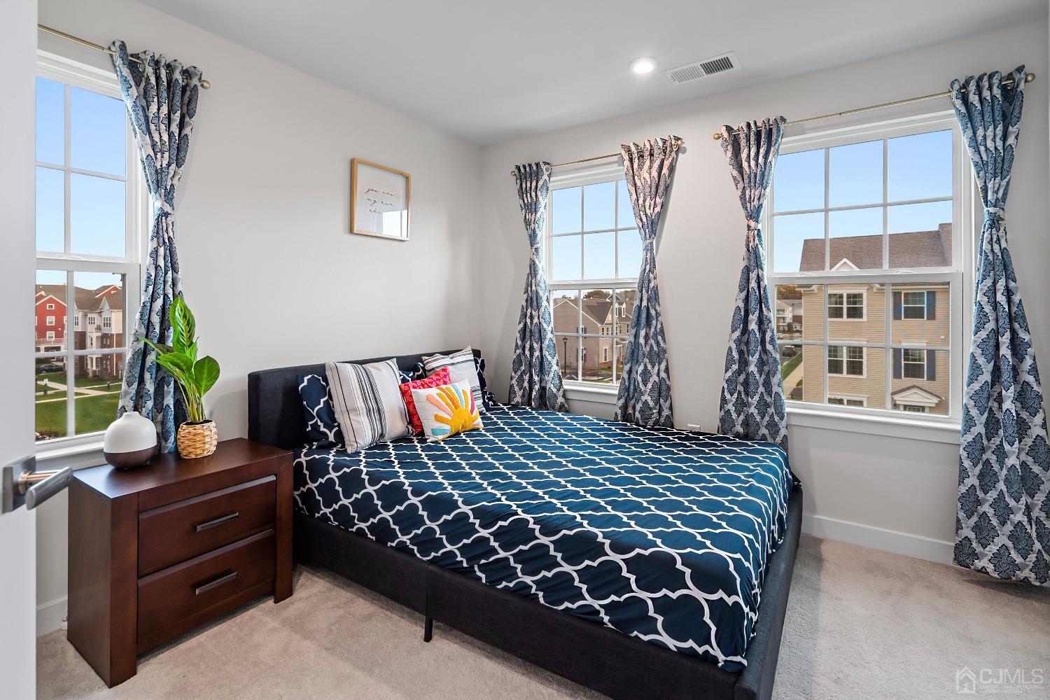 26 American Way Cliffwood, NJ 07721 - Photo 25 of 32 a bedroom with a bed and a window