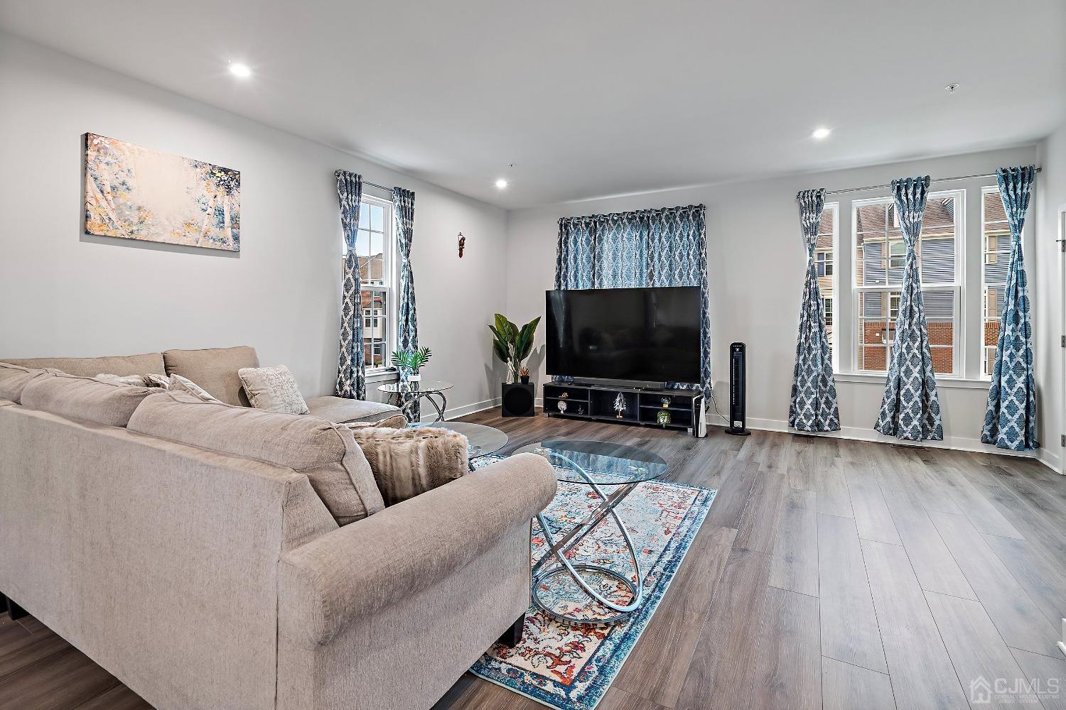 26 American Way Cliffwood, NJ 07721 - Photo 10 of 32 a living room with furniture and a flat screen tv