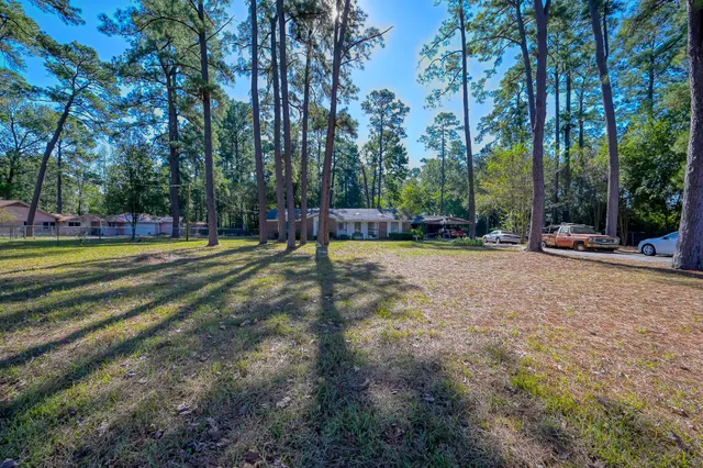 a view of a park with swings and trees