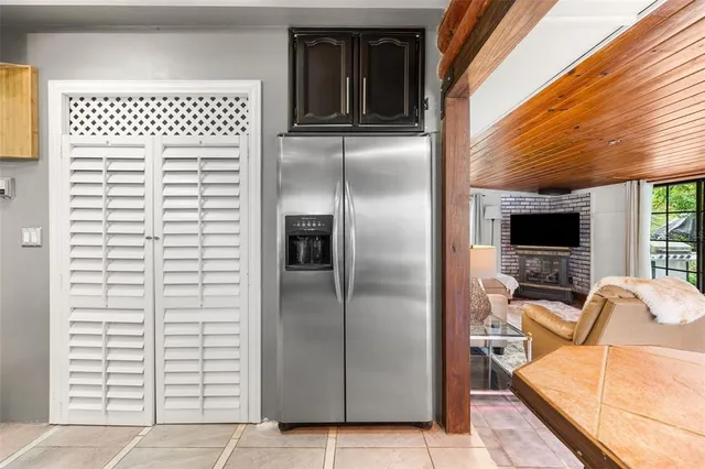 a bedroom with furniture and a flat screen tv