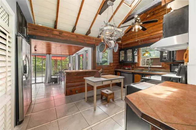 a spacious bedroom with a large bed and a large window