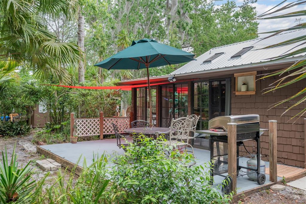 133 Seminole Trail Georgetown, FL 32139 - Photo 32 of 87 a view of a patio with chairs under an umbrella
