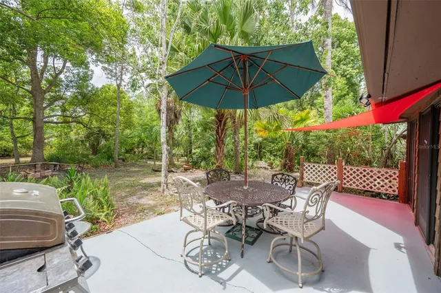 a view of a yard with a tree