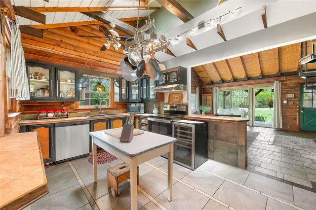 a bedroom with furniture and a large window