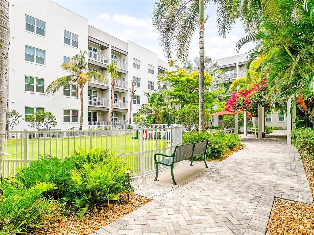 700 Cocoanut Avenue, Unit 331 Sarasota, FL 34236 - Photo 11 of 25 a view of a building with a bench and sitting area