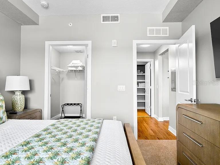 700 Cocoanut Avenue, Unit 331 Sarasota, FL 34236 - Photo 17 of 25 a bedroom with a bed and a dresser