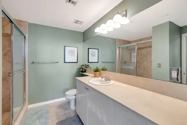 a spacious bathroom with a bathtub shower sink and toilet