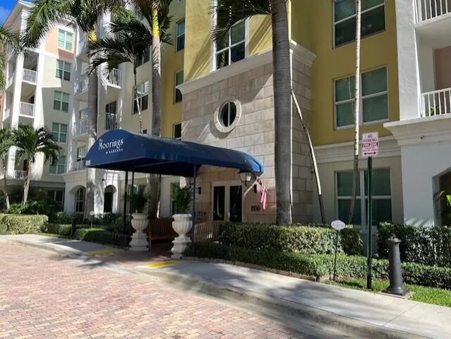 front view of a building with a garden