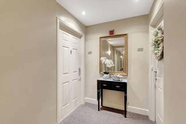 a bathroom with a granite countertop sink a mirror and a vanity