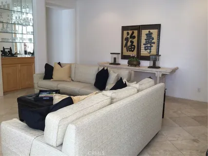 a living room with couches and a window