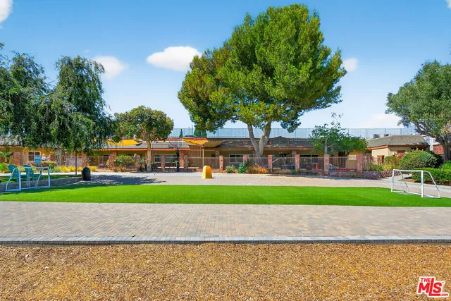 a view of a park with large trees