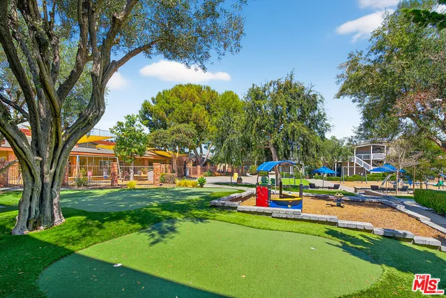 a childrens park with lots of swings and slides