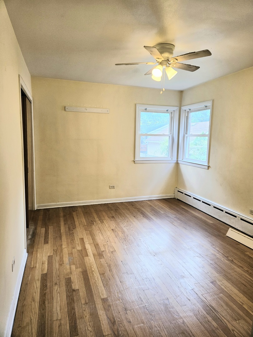 100 Forest Avenue Riverside, IL 60546 - Photo 8 of 15 wooden floor in an empty room with a window