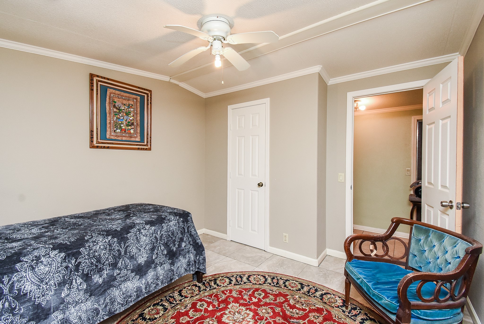 39551 Donigan Road Brookshire, TX 77423 - Photo 27 of 37 Bedroom featuring ornamental molding, a ceiling fan, and light tile patterned flooring