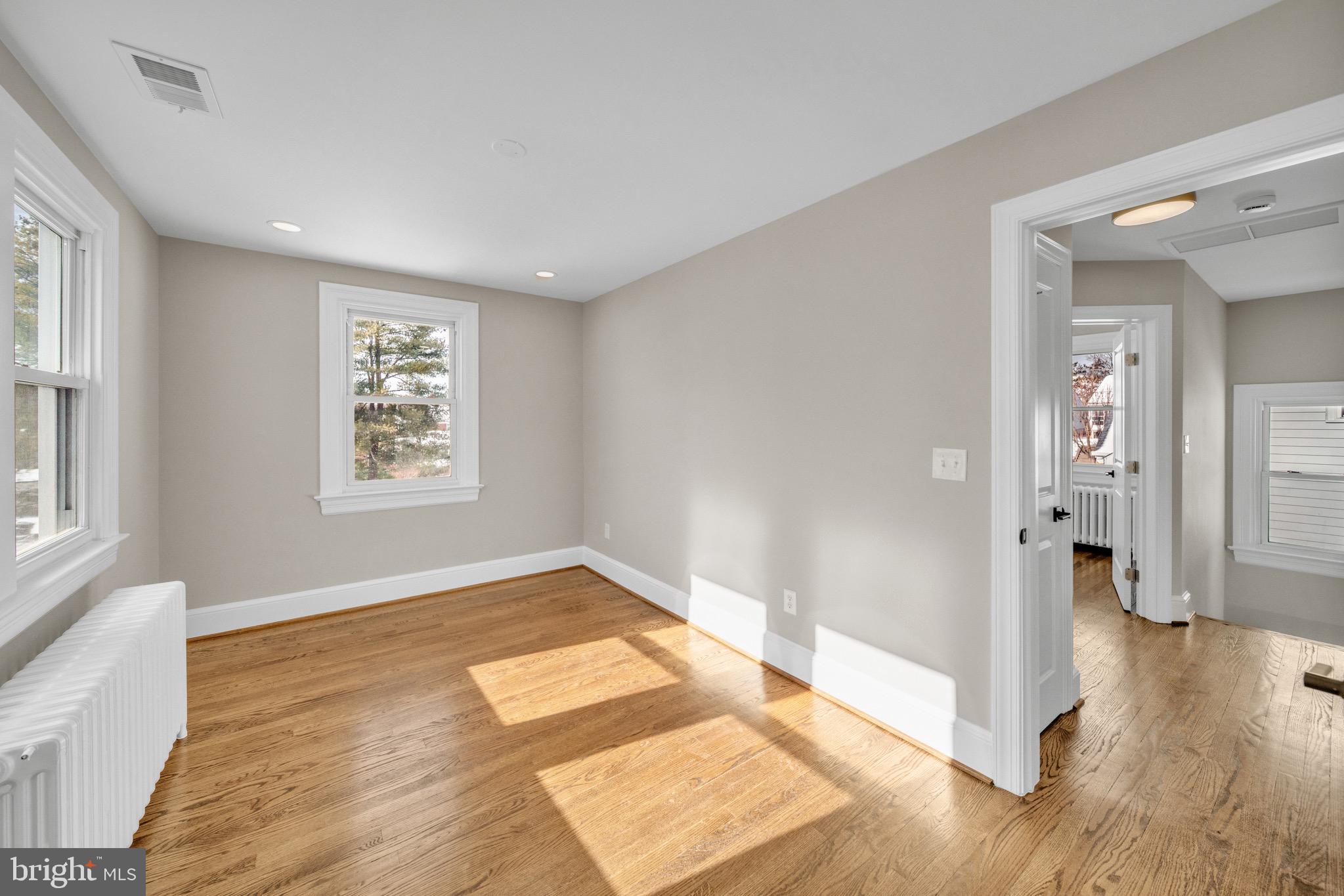 6018 2nd Street Northwest Washington, DC 20011 - Photo 11 of 18 an empty room with wooden floor and windows