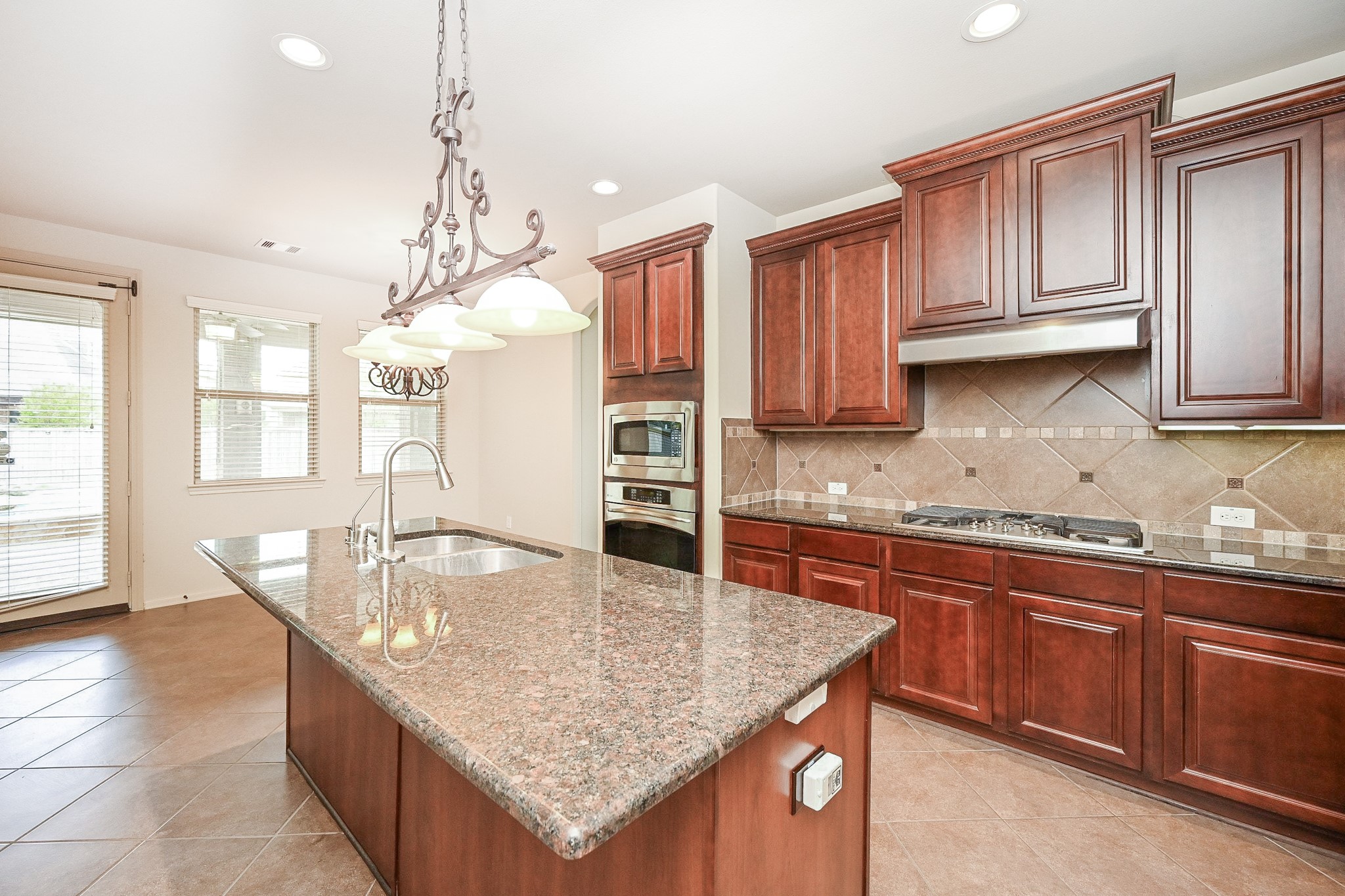 19 Sandwell Place Spring, TX 77389 - Photo 16 of 33 Spacious kitchen with abundant cabinets, breakfast nook and seamless flow to backyard.