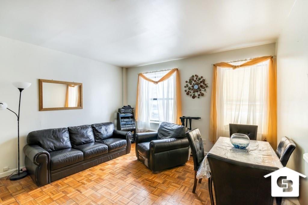 9 Argyle Road, Unit B3 Brooklyn, NY 11218 - Photo 2 of 10 a living room with furniture and a window