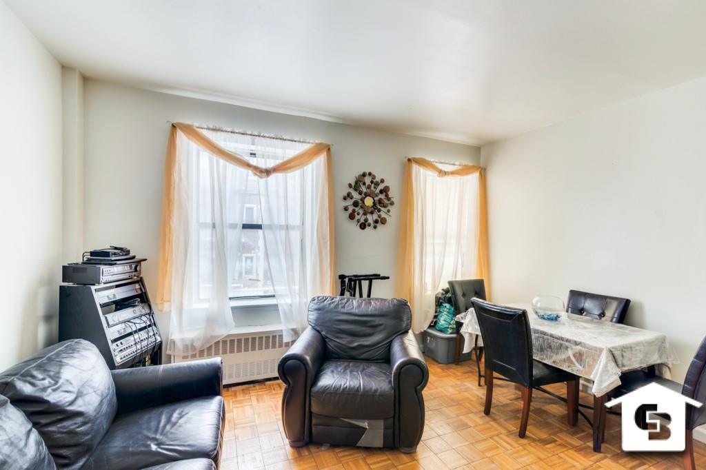 9 Argyle Road, Unit B3 Brooklyn, NY 11218 - Photo 3 of 10 a living room with furniture and a large window