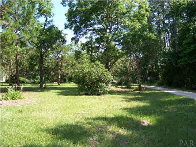 10163 South Loop Road, Unit 1 Pensacola, FL 32507 - Photo 3 of 13 A view from the front of the barn to the entrance road (easement access) off of South Loop Road