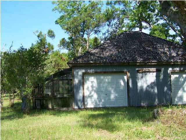 10163 South Loop Road, Unit 1 Pensacola, FL 32507 - Photo 4 of 13 View of greenhouses attached to barn