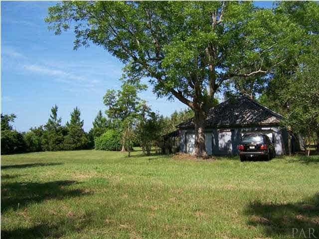 10163 South Loop Road, Unit 1 Pensacola, FL 32507 - Photo 7 of 13 the barn from the road