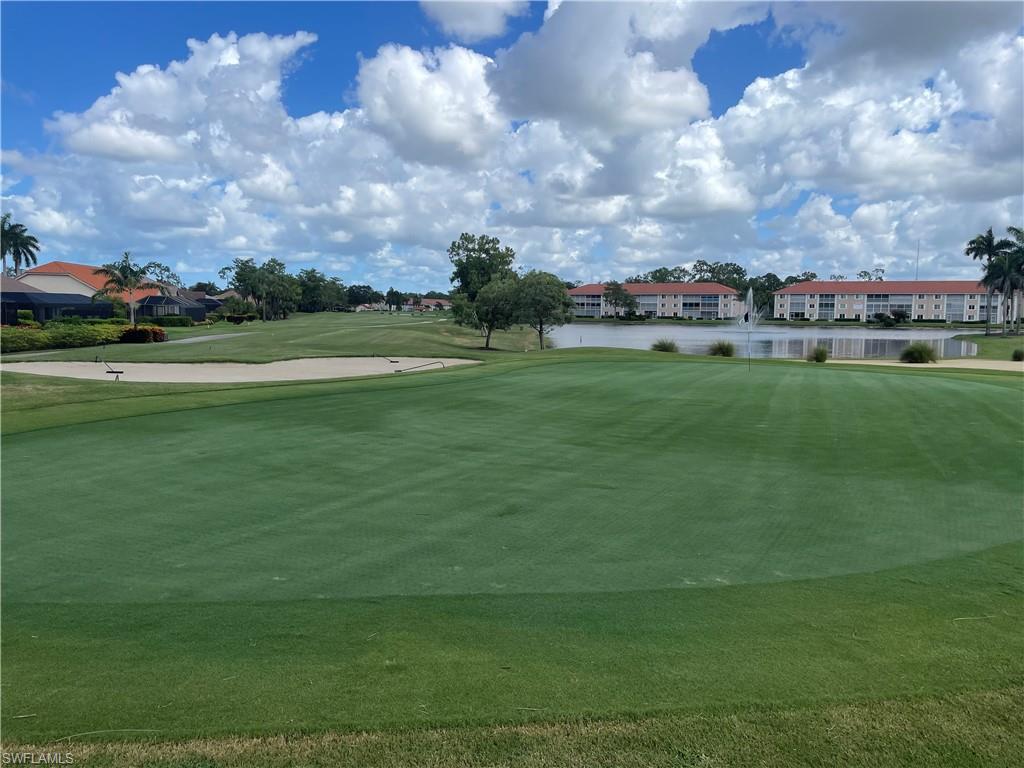 5970 Amherst Drive, Unit C103 Naples, FL 34112 - Photo 19 of 24 View of community with golf course view and a water view