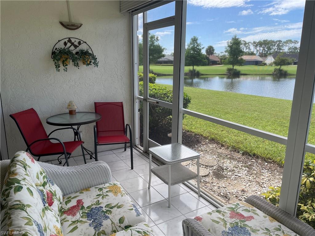 5970 Amherst Drive, Unit C103 Naples, FL 34112 - Photo 4 of 24 Sunroom / solarium with a water view
