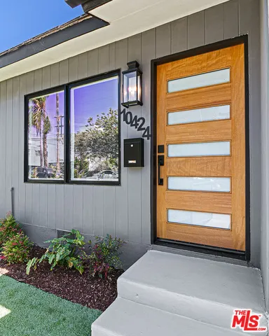 a kitchen with stainless steel appliances granite countertop a stove a refrigerator a sink a counter space and cabinets