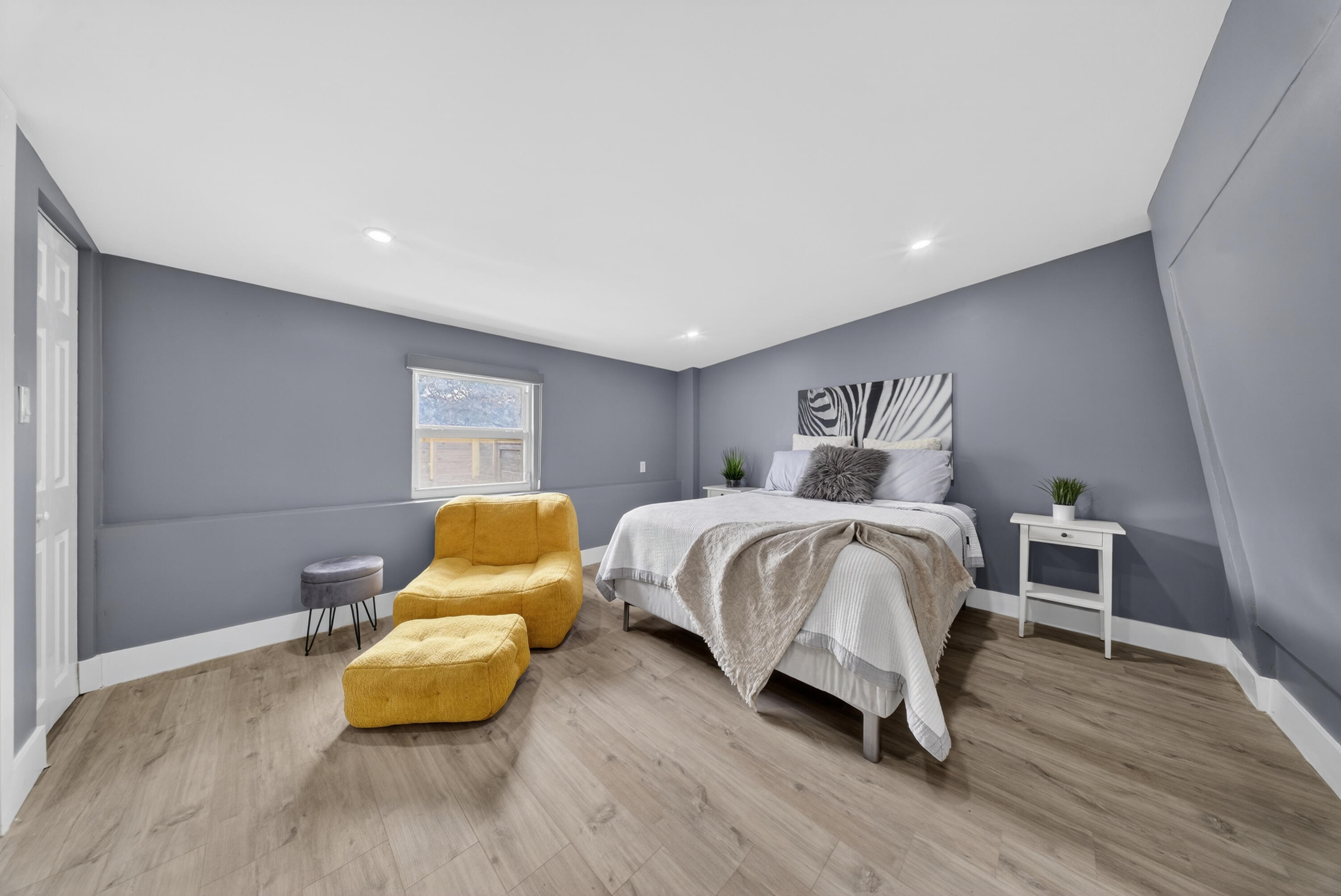 801 Southeast 15th Street Stuart, FL 34994 - Photo 15 of 25 a bedroom with a bed and wooden floor