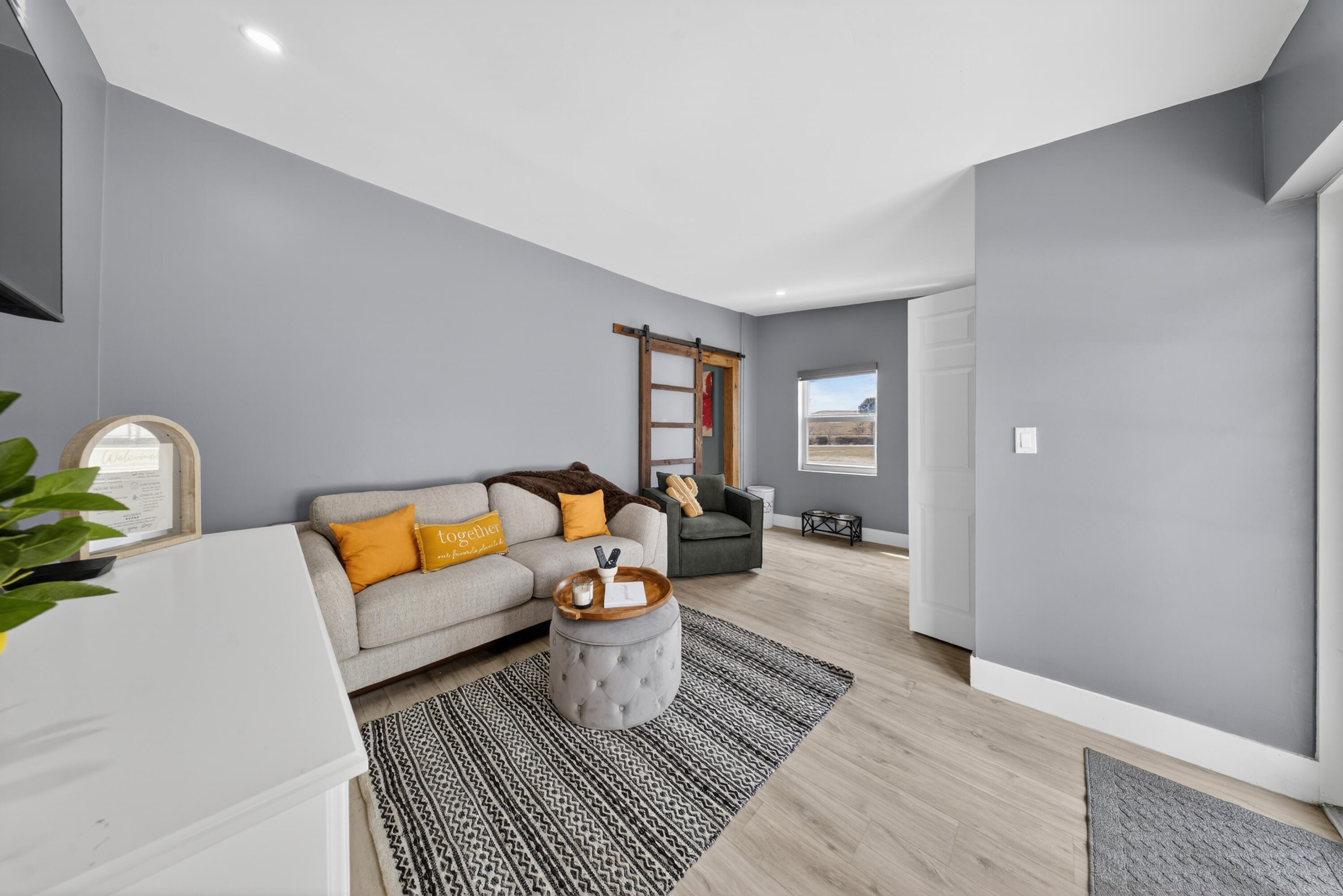 801 Southeast 15th Street Stuart, FL 34994 - Photo 18 of 25 a living room with furniture and wooden floor