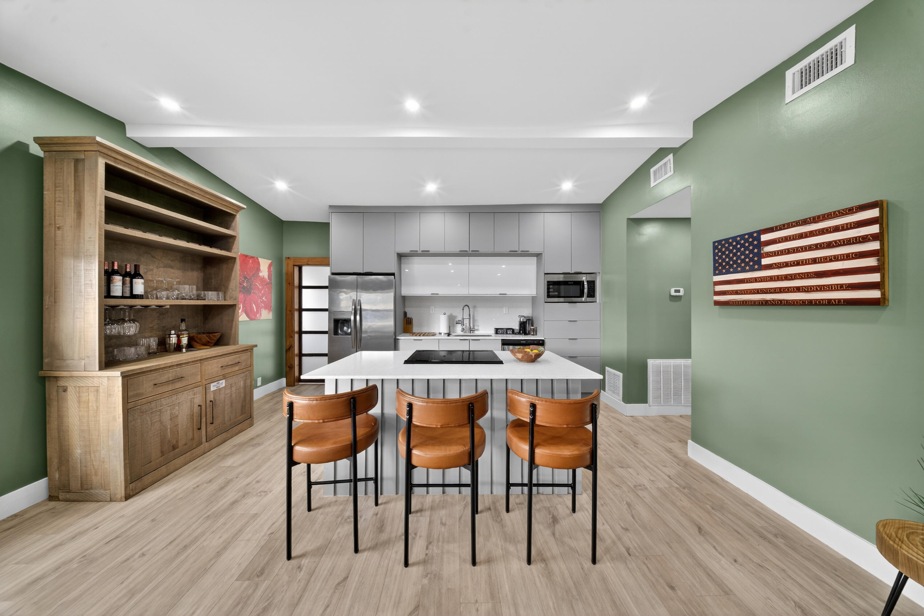 801 Southeast 15th Street Stuart, FL 34994 - Photo 5 of 25 a kitchen with a table chairs refrigerator and cabinets