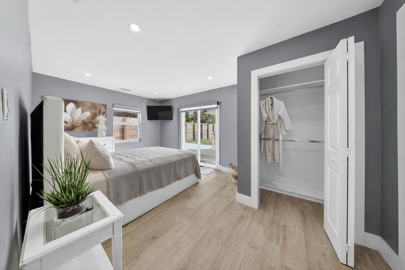 801 Southeast 15th Street Stuart, FL 34994 - Photo 8 of 25 a bedroom with a large bed and a potted plant