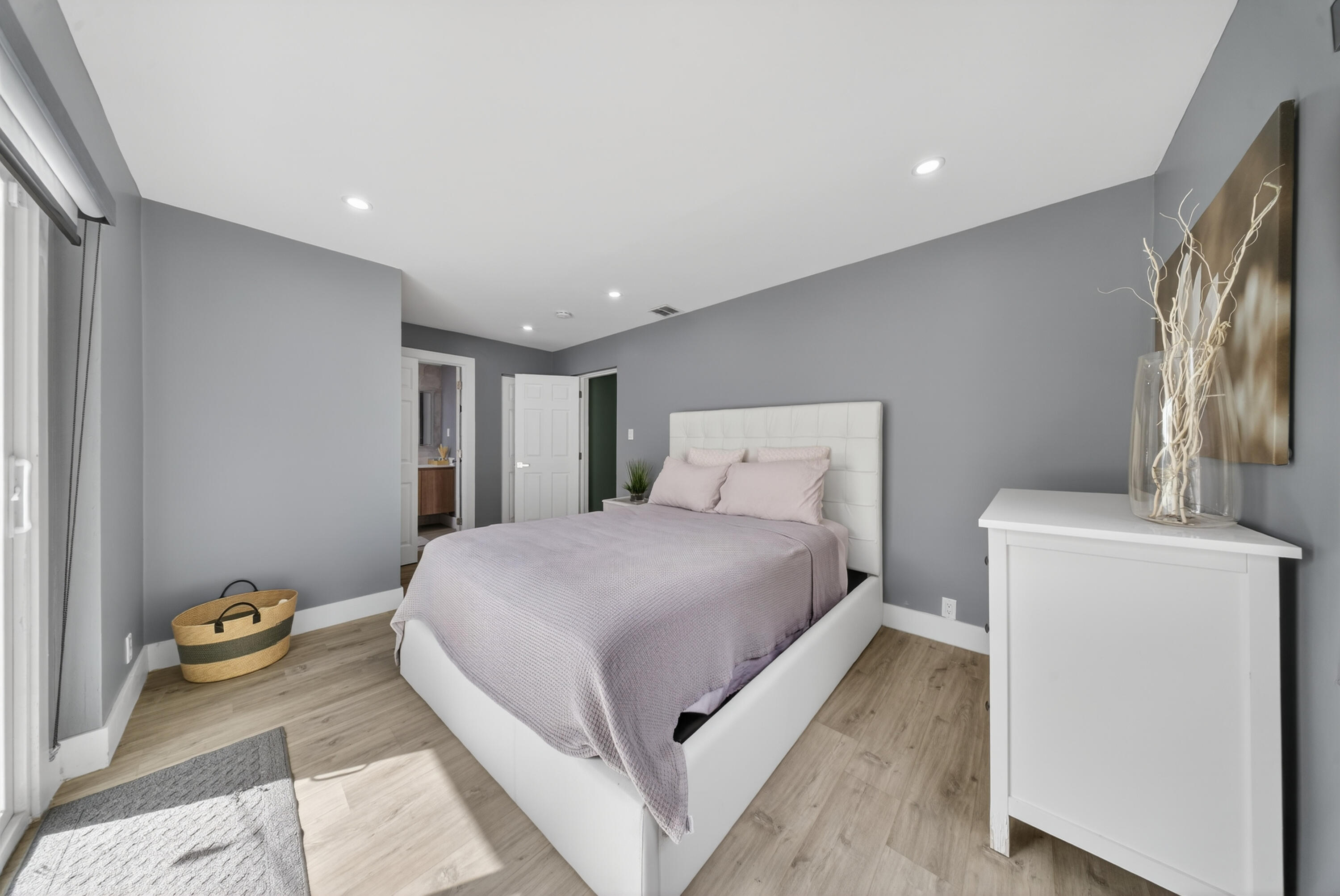 801 Southeast 15th Street Stuart, FL 34994 - Photo 9 of 25 a bedroom with a bed and a couch