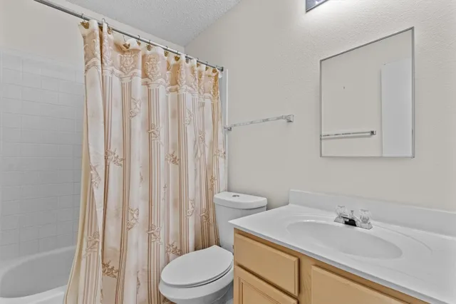 a bedroom with bed and window