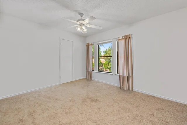 a bathroom with a sink a toilet and shower curtain