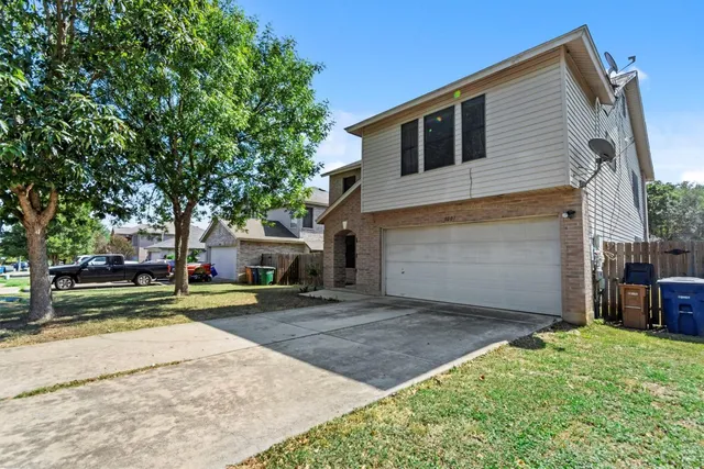 front view of a house with a yard