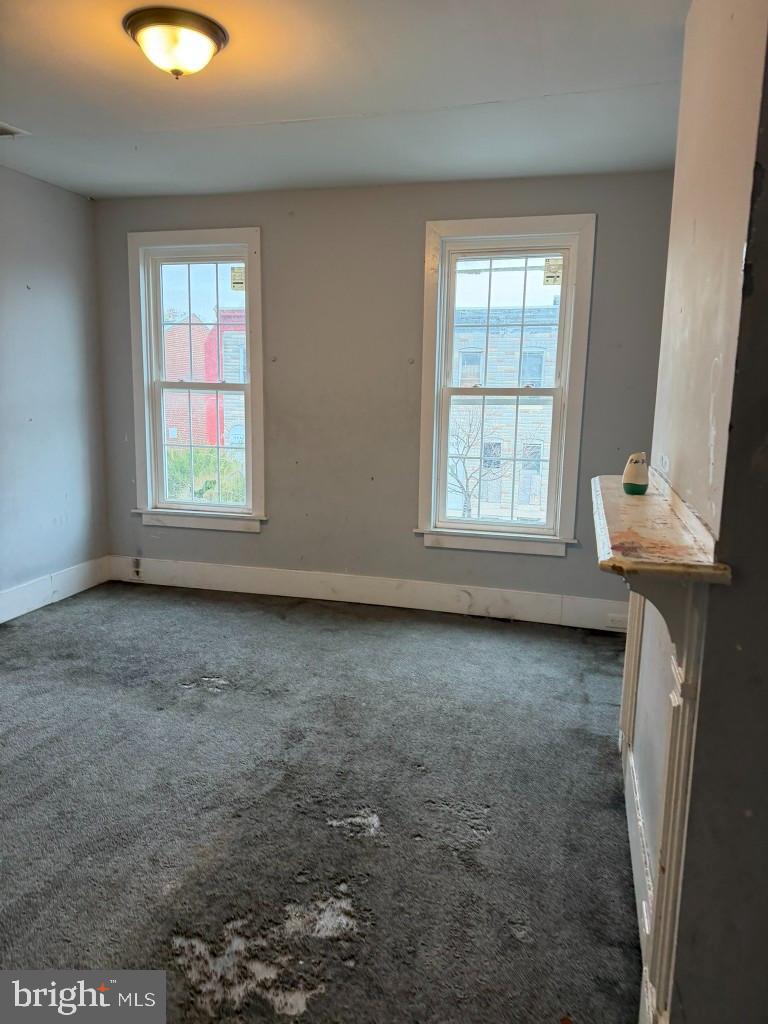 1409 East Lanvale Street Baltimore, MD 21213 - Photo 12 of 25 an empty room with a window
