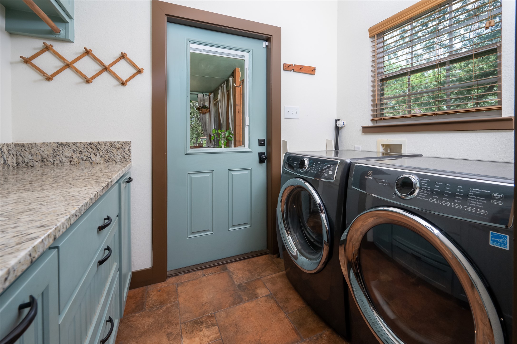 270 Dry Creek Road Manor, TX 78653 - Photo 18 of 40 Functional laundry room offers a convenient side-by-side washer and dryer with counter space.