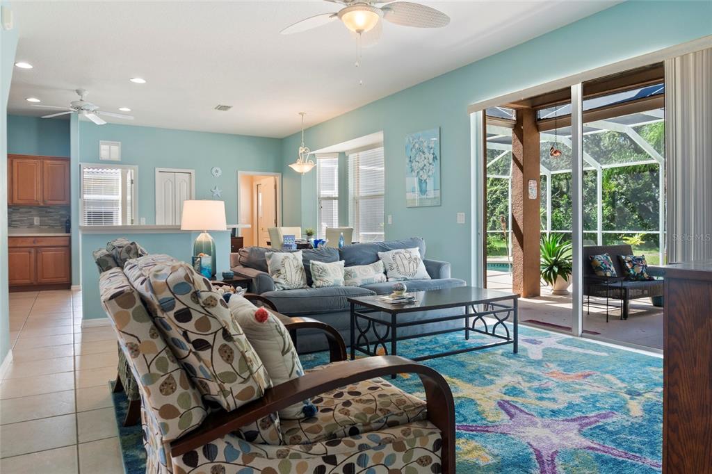 8746 Stone Harbour Loop Bradenton, FL 34212 - Photo 12 of 71 a living room with furniture and a large window