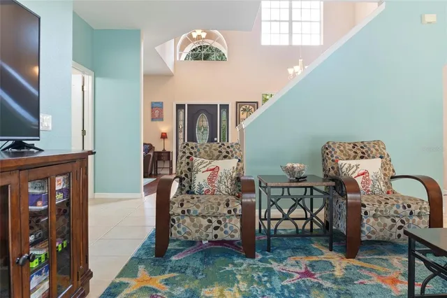 a living room with kitchen furniture and a wooden floor