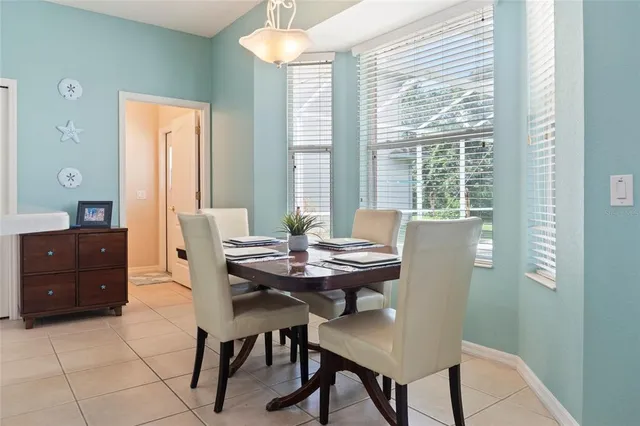 a kitchen with stainless steel appliances granite countertop a sink a stove a refrigerator and cabinets