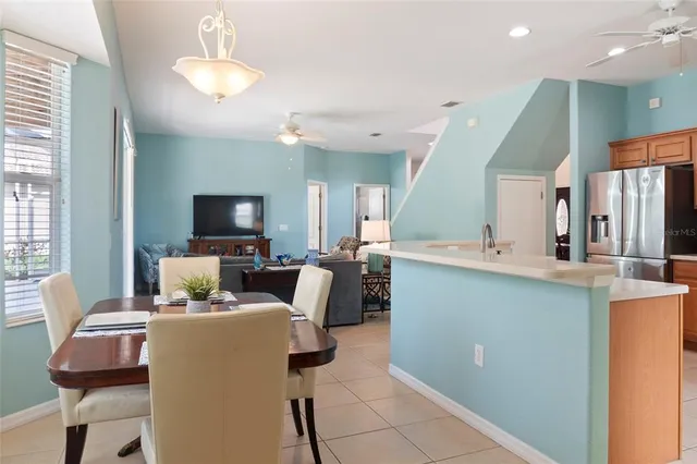 a kitchen with stainless steel appliances granite countertop a stove a refrigerator and a microwave