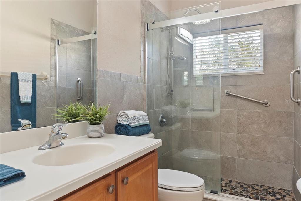 8746 Stone Harbour Loop Bradenton, FL 34212 - Photo 25 of 71 a bathroom with a sink toilet and shower