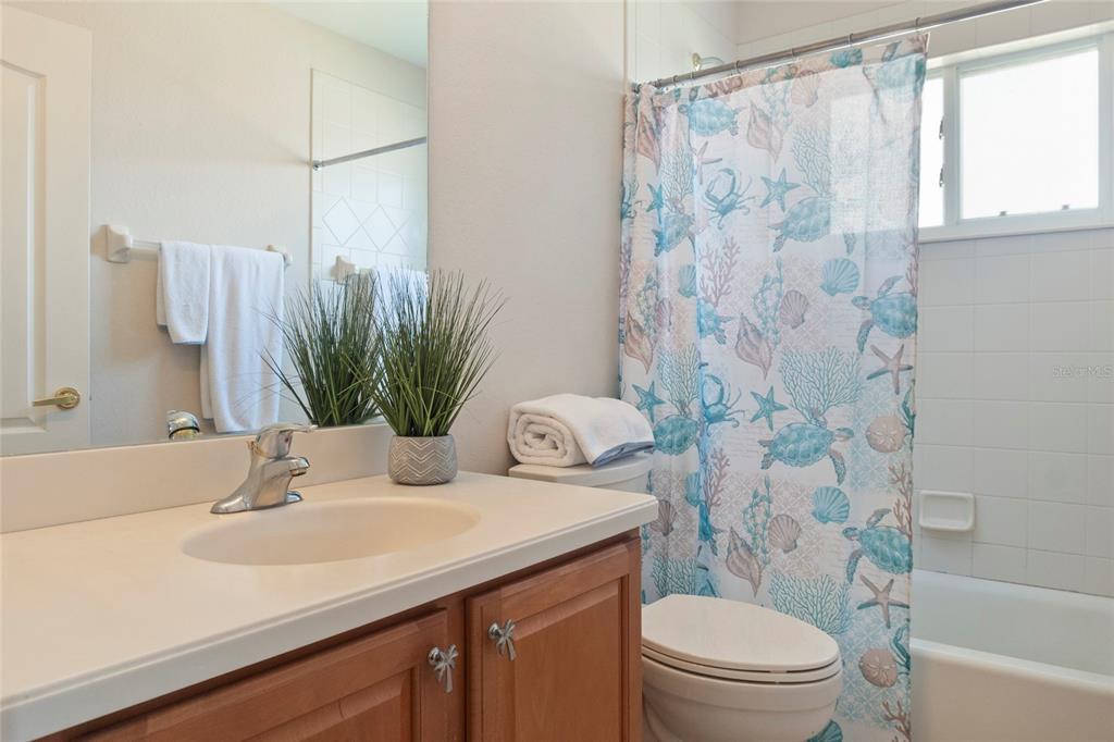 8746 Stone Harbour Loop Bradenton, FL 34212 - Photo 37 of 71 a bathroom with a sink a toilet and shower