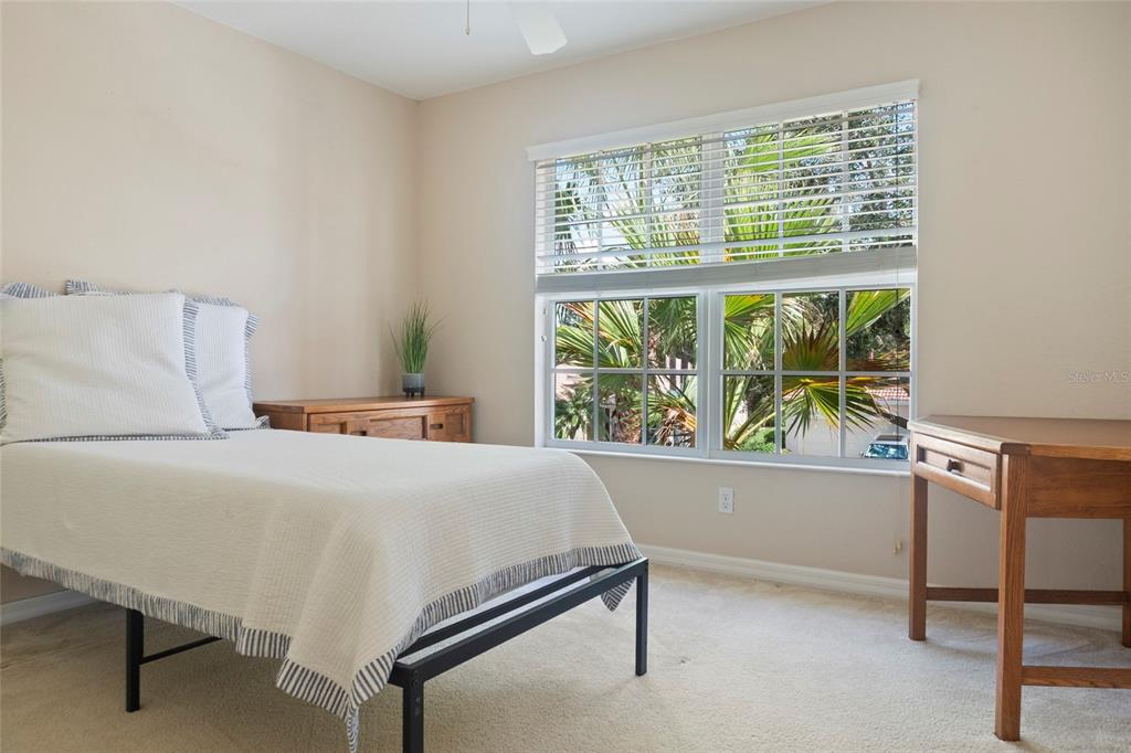 8746 Stone Harbour Loop Bradenton, FL 34212 - Photo 38 of 71 a bedroom with a bed and a table