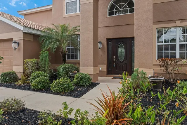 a living room with furniture a table and a large window