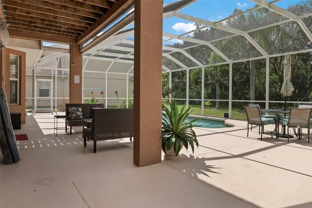 an aerial view of residential houses with outdoor space and river
