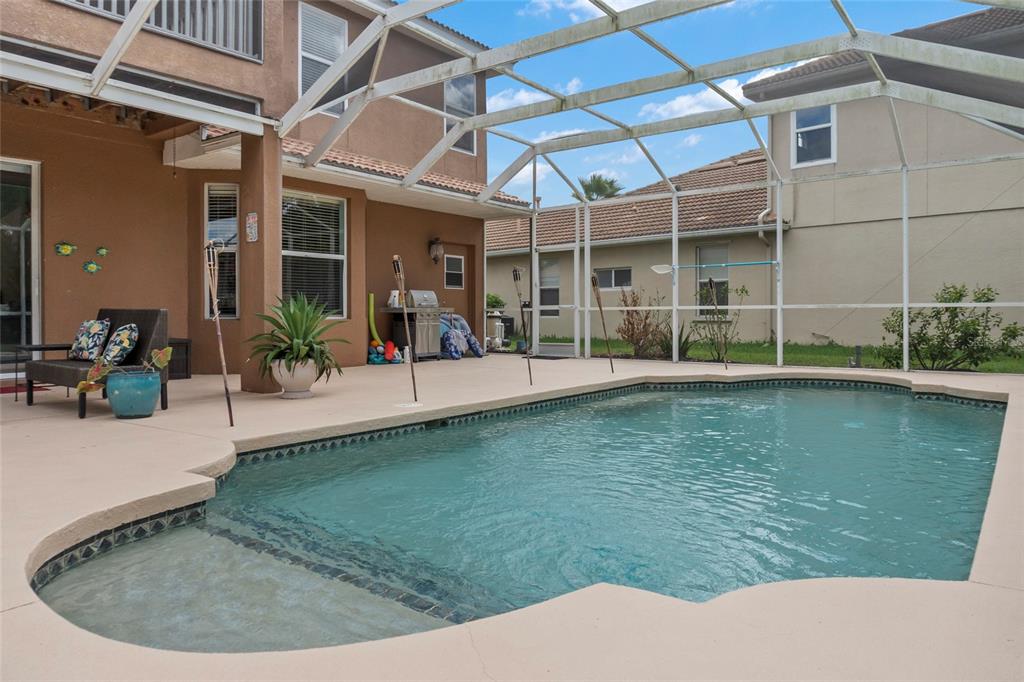 8746 Stone Harbour Loop Bradenton, FL 34212 - Photo 44 of 71 a view of a swimming pool with an outdoor seating